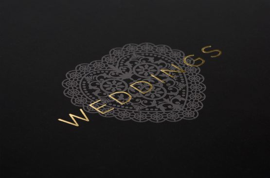 A close up of the front cover foiling detail from the Channels Weddings brochure