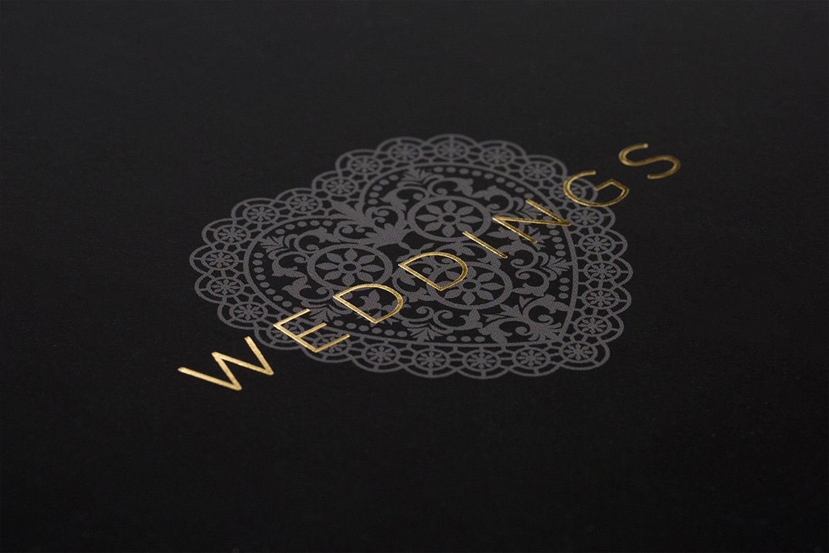 A close up of the front cover foiling detail from the Channels Weddings brochure