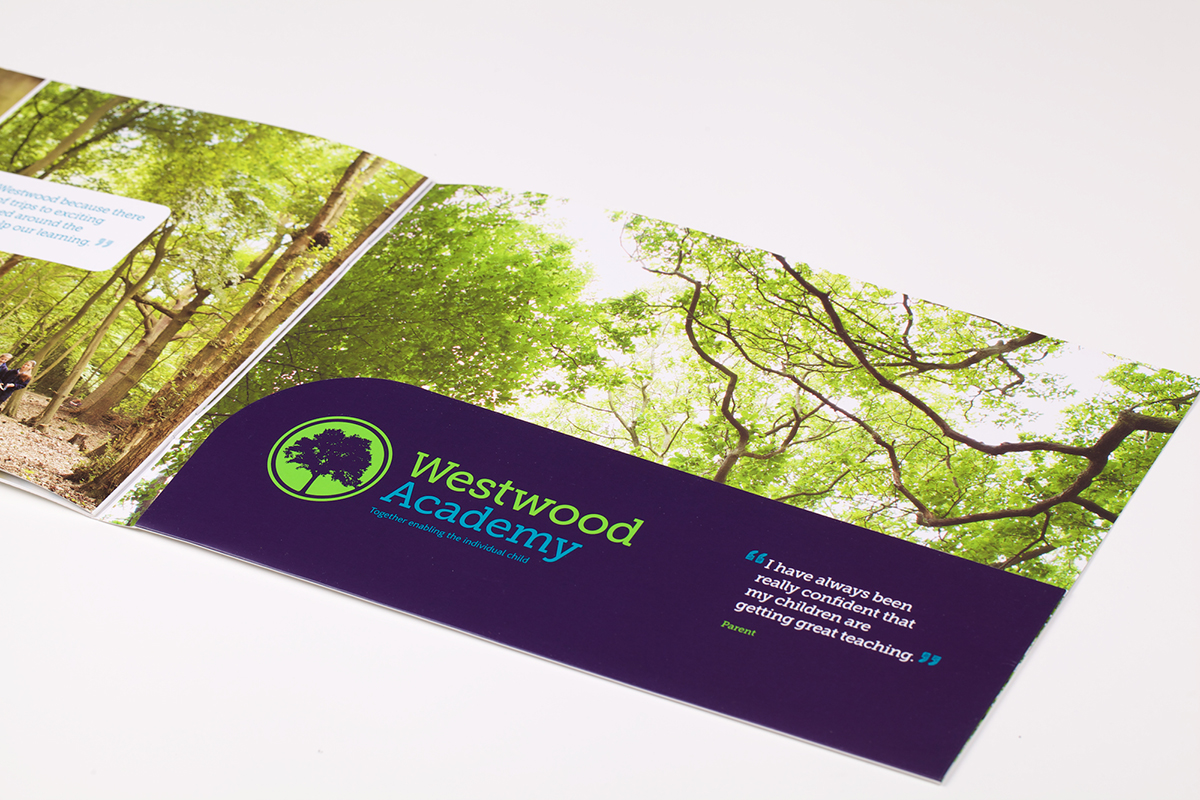An image of the Westwood Academy brochure folded out on a table